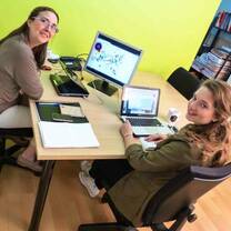 Montse and Adrienne working