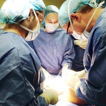 Medical intern observing a surgical procedure during an international healthcare internship abroad