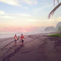 Surfers on the beach in Costa Rica 
