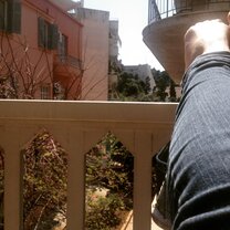 View of Panathenaic Stadium just past my feet in early April when the orange trees were just blooming!