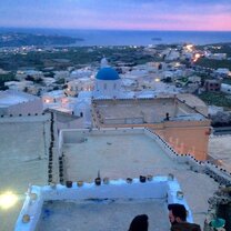 Rooftop sunset in Santorini -- pictures don't even come close to doing it justice