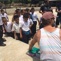 Donating school supplies to the local community