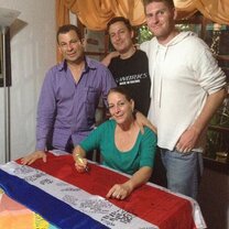 My host family signing my CR flag. My most precious souvenir.