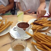 Eating churros and chocolate at our favorite cafe.