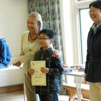 a junior student receives his Oxford International Study Centre certificate . 