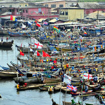 Colorful boats docked in the coastal town of Elmina, Ghana.