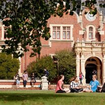 Lincoln is a unique mix of historic and modern students sitting on lawn