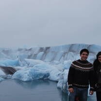 SIT students in Greenland smiling at a glacier research site.