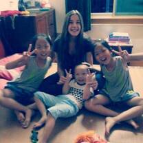 girl smiling with kids