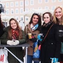 Students enjoying a hot beverage at the annual Christmas market in Salzburg