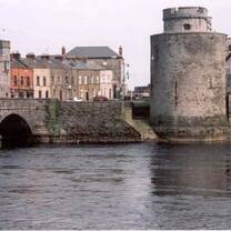 grey stone tower and bridge in water