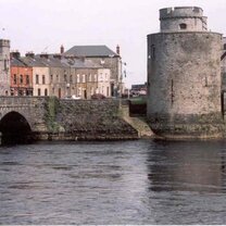 grey stone tower and bridge in water