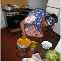 A woman cooking in a kitchen 