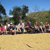 ICADS students learn about coffee production at a fair trade cooperative. 