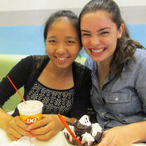 two girls smiling with ice cream