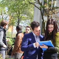 Two students reading a textbook together