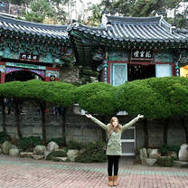 English teacher in South Korea in front of an old traditional building