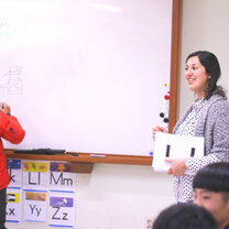 You can choose between private language centres and public schools in South Korea english teacher in south korea with student
