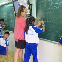 Our teaching placements in Vietnam are at private language centres for ages kindergarten and upwards English teacher in Vietnam in front of class