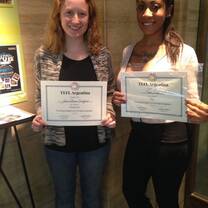 Graduates Jessie and Suvi receive their diplomas