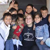 Volunteer with children at Masroor Ahmad school as a teacher support or teaching