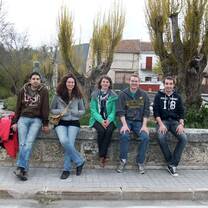 VFP Volunteers rest on a wall during a project in Spain