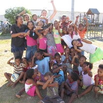 A happy group of children and volunteers in South Africa.