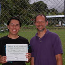 Proud smile from a recent graduate from Proyecto San Gerardo computer course