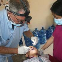  A medical volunteer helping a local child