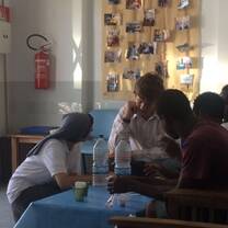 Volunteers talking to Refugees in Italy