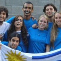 Volunteers holding the Uruguay flag