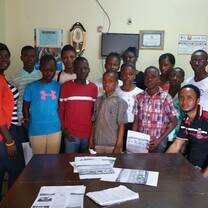 Our Team of local volunteers with beneficiary school children in Fretown