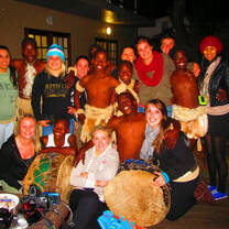 Volunteers with Zulu dancers