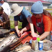CPP participants cleaning salmon with our La Push partners.