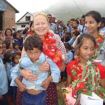 NRO volunteer working in school