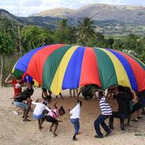 Volunteers and Kids with Parachute