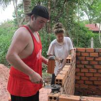 Volunteers building a community latrine