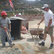 A volunteer and a local worker taking a well deserved break