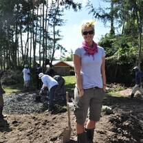 A volunteer helping to build a water tank