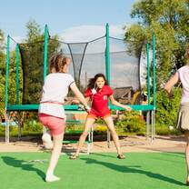 Volunteer skipping with children on summer language camp, Russia, Jun 2013