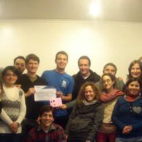 The office staff says good-bye to an international volunteer.