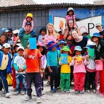 Teachers and students standing outside the school