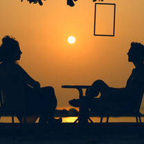 Talking during sunset at the beach of Samma Karuna