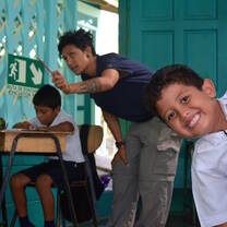 A volunteer teacher during class at the community school.