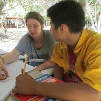 Granada Street Kids - Volunteer working with a student