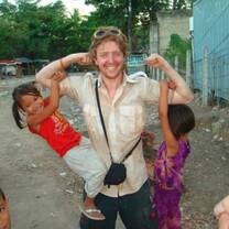 A volunteer shows off his strength