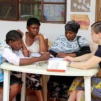Volunteer with women in Tanzania