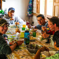 Eco-volunteers and Tropical Cordillera Foundation staff share lunch.