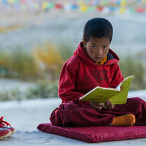 A local Indian child reading a book