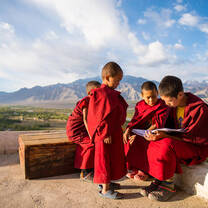A group of Indian children reading a book